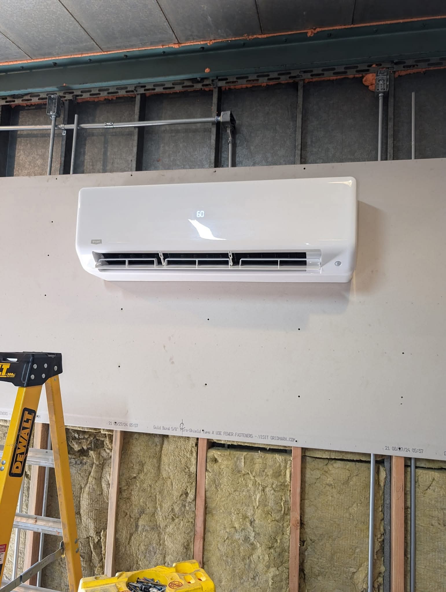 Mini split outdoor compressor installed on bracket