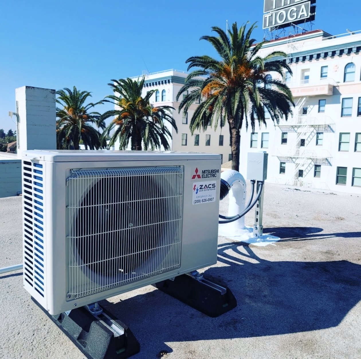 ZACS AIR SYSTEMS repairing an outdoor AC unit in Merced, CA