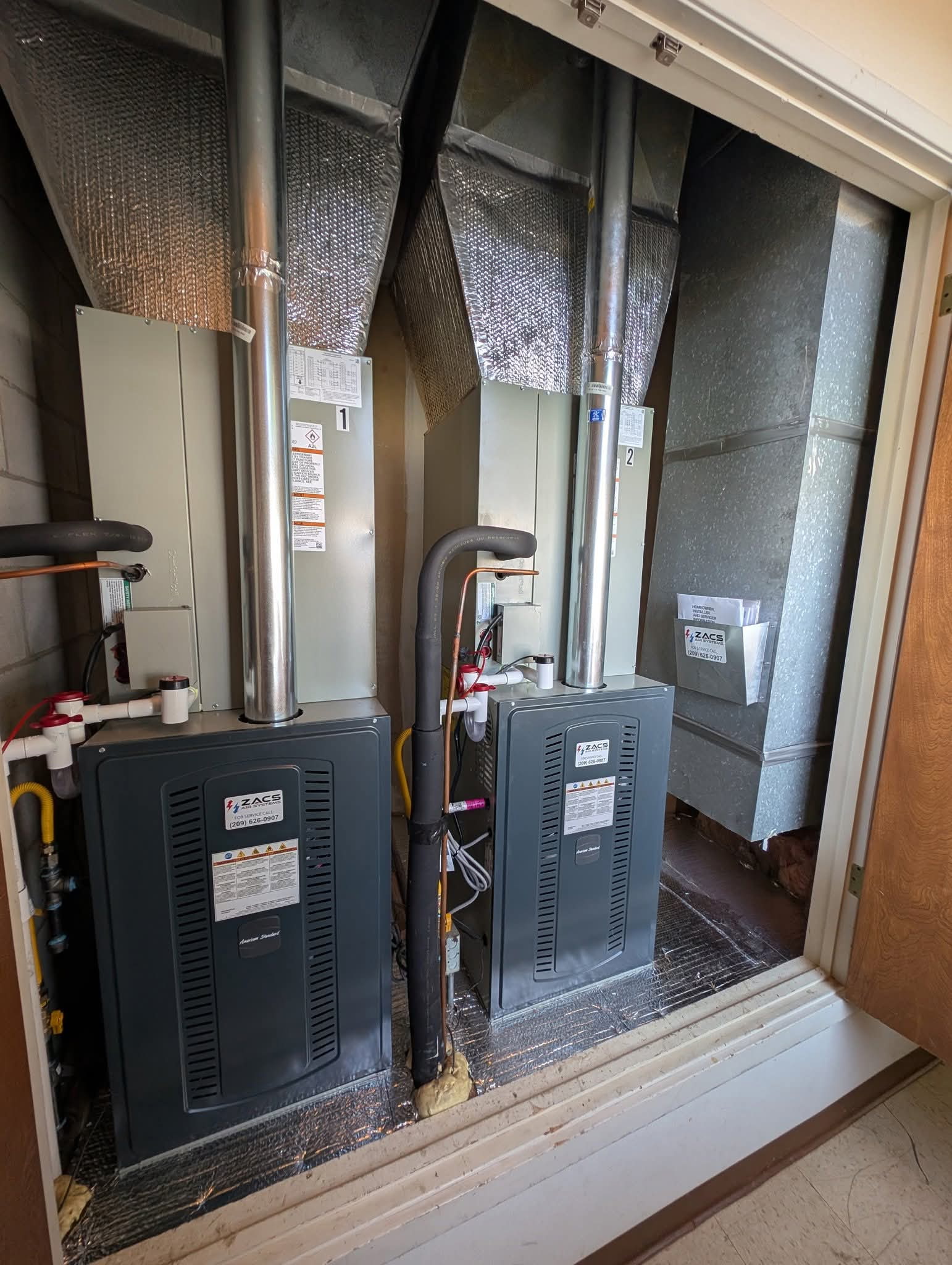 Commercial HVAC installation with multiple rooftop AC units by ZACS AIR SYSTEMS